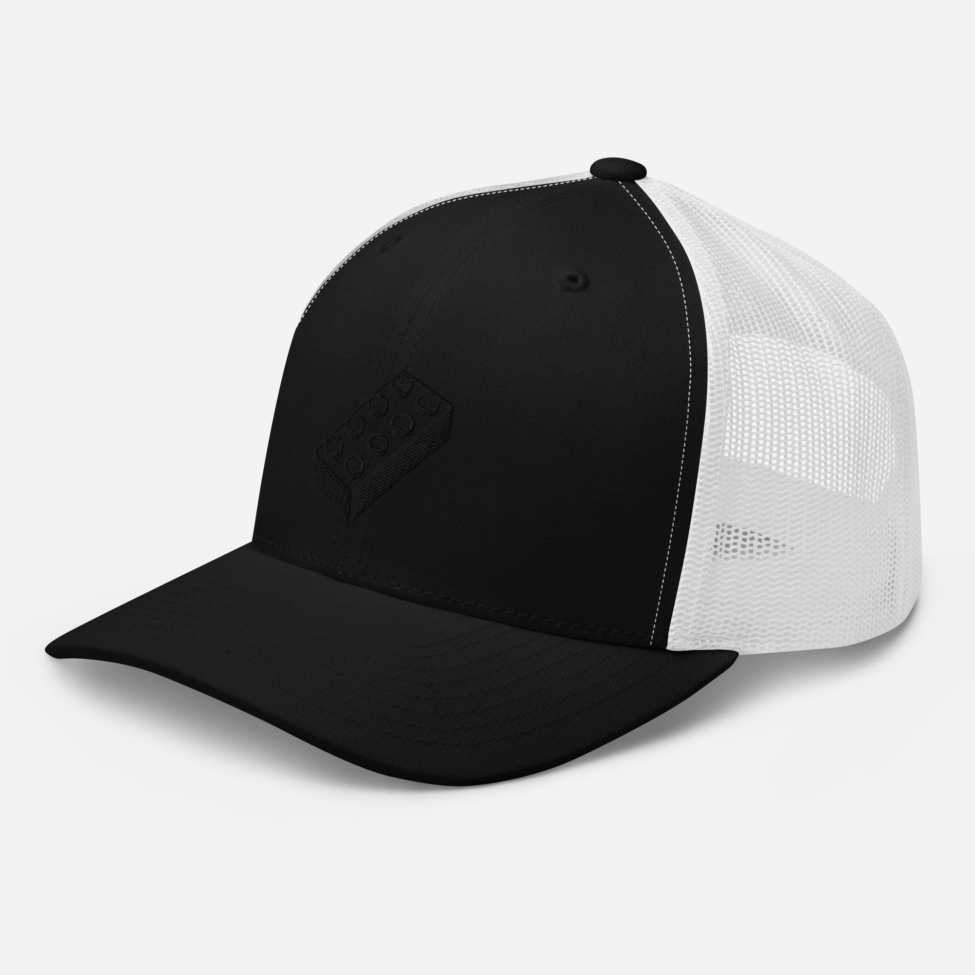 a black and white trucker cap with a lego embroidered brick design